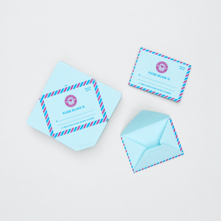 Set of light blue envelopes with red and blue striped borders on a white background