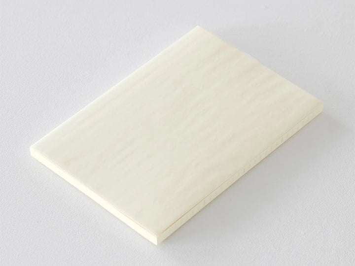 Beige notebook on a light gray background