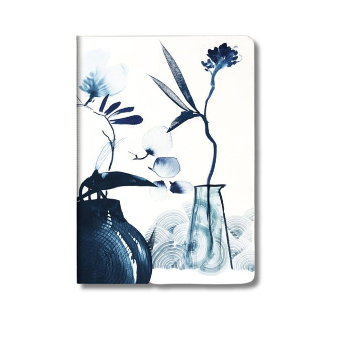 Notebook with blue floral elements and a vase on a white background.