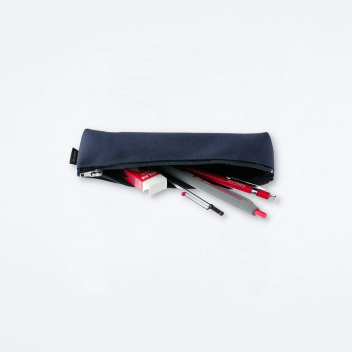 Navy blue pencil case with stationery items on a light gray background