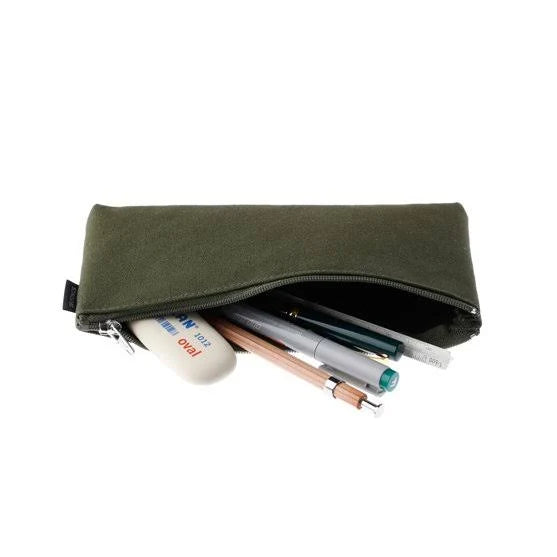 Green pencil case with stationery items on a white background