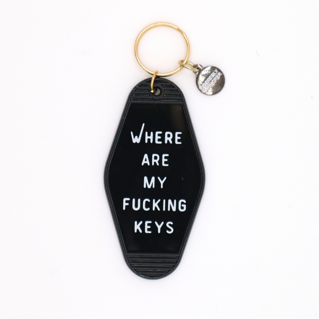 Black keychain with white text 'WHERE ARE MY FUCKING KEYS' on a white background
