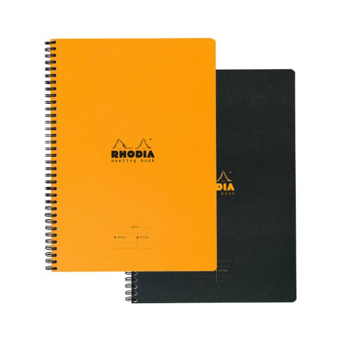Orange and black Rhodia notebooks on a white background