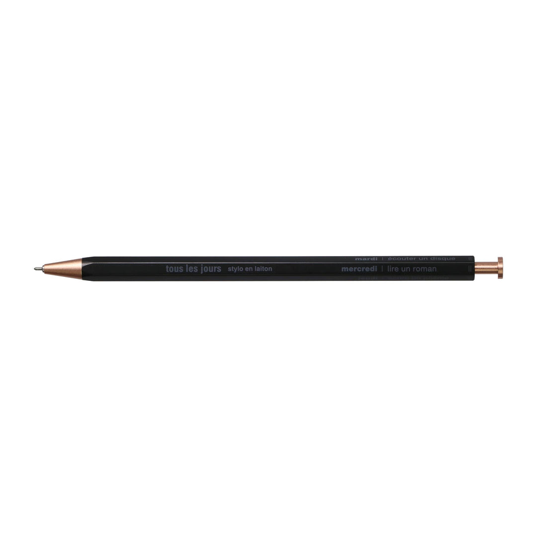 A selection of ballpoint pens with brass bodies, available in gold, silver, and rose gold colors, displayed alongside their packaging boxes.