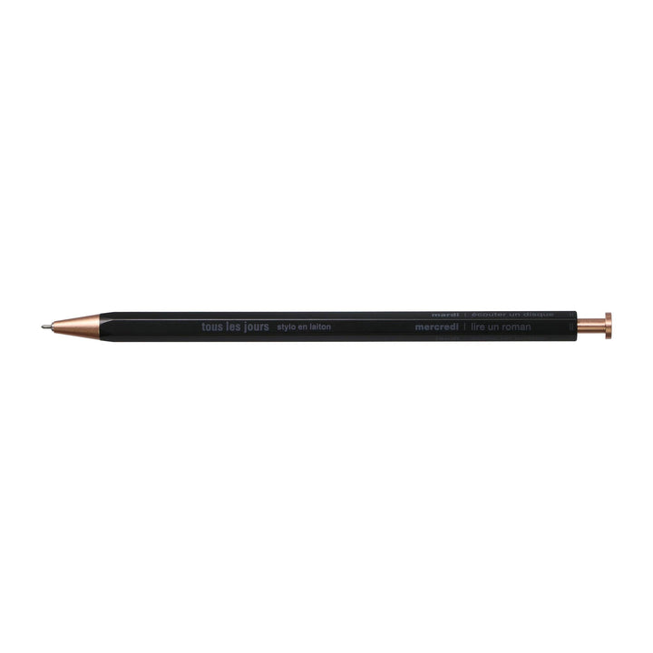 A selection of ballpoint pens with brass bodies, available in gold, silver, and rose gold colors, displayed alongside their packaging boxes.