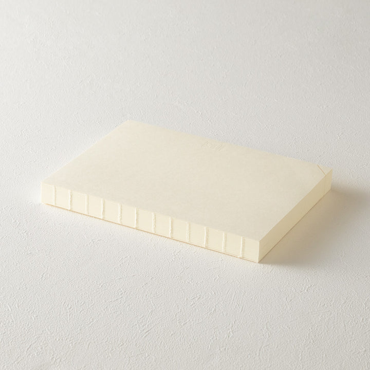 Stack of white paper on a light gray background