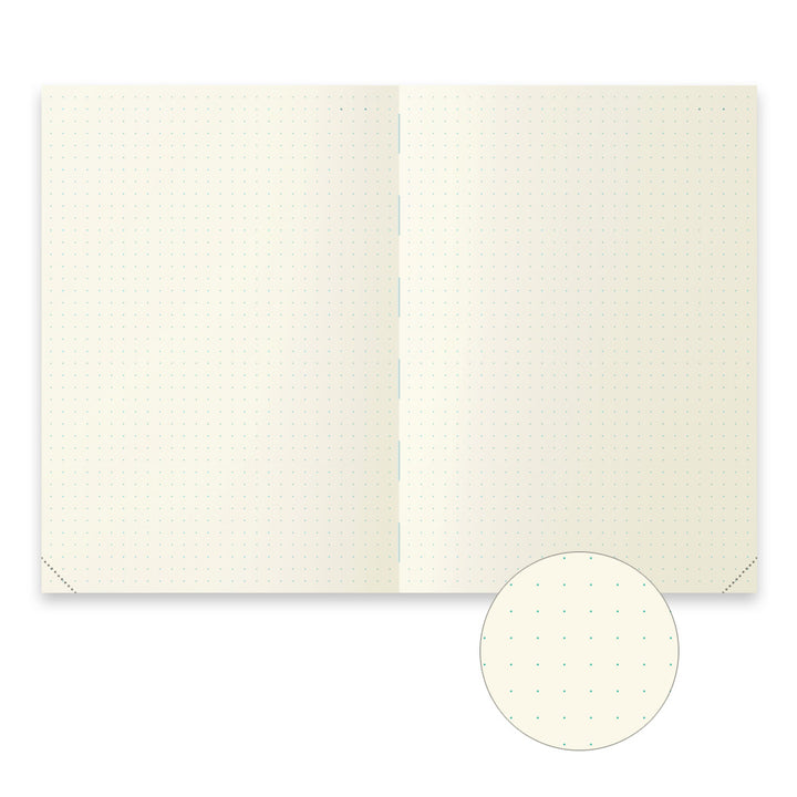 Open notebook with cream-colored pages on a white background