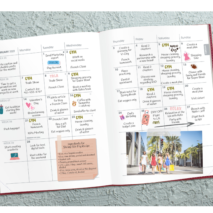 Open planner with daily schedule and photo of people on a beach
