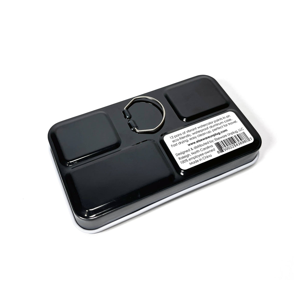 Black travel paint set with compartments on a white background