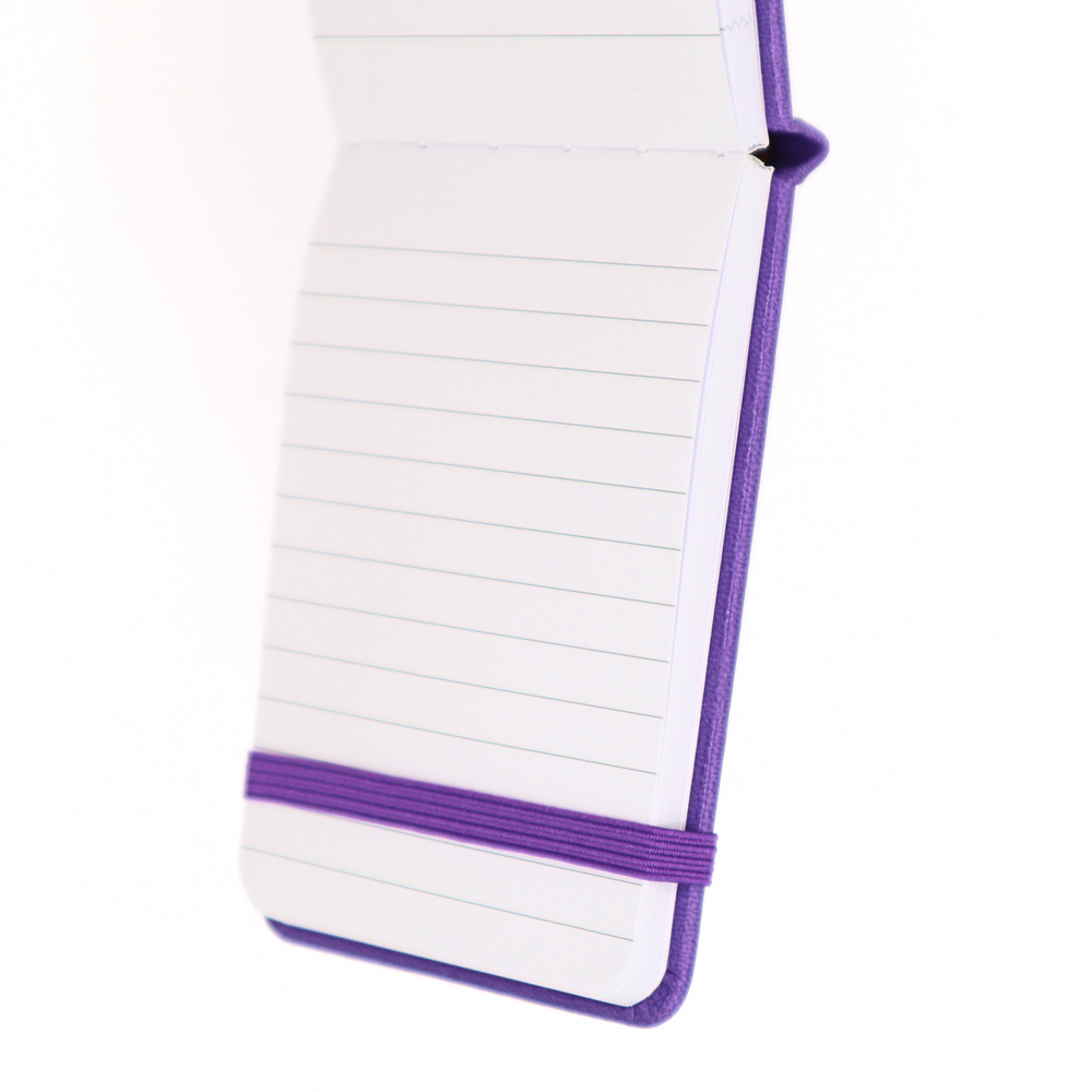 Notepad with purple binding on a white background