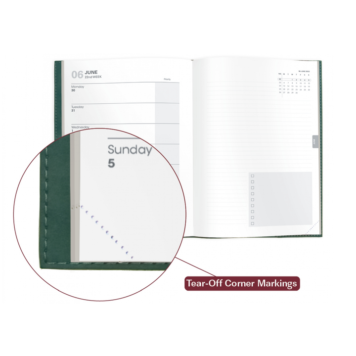 Green notebook with tear-off corner markings on a white background