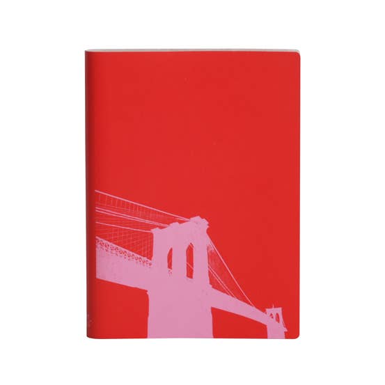 Red notebook with a white silhouette of a bridge on a white background