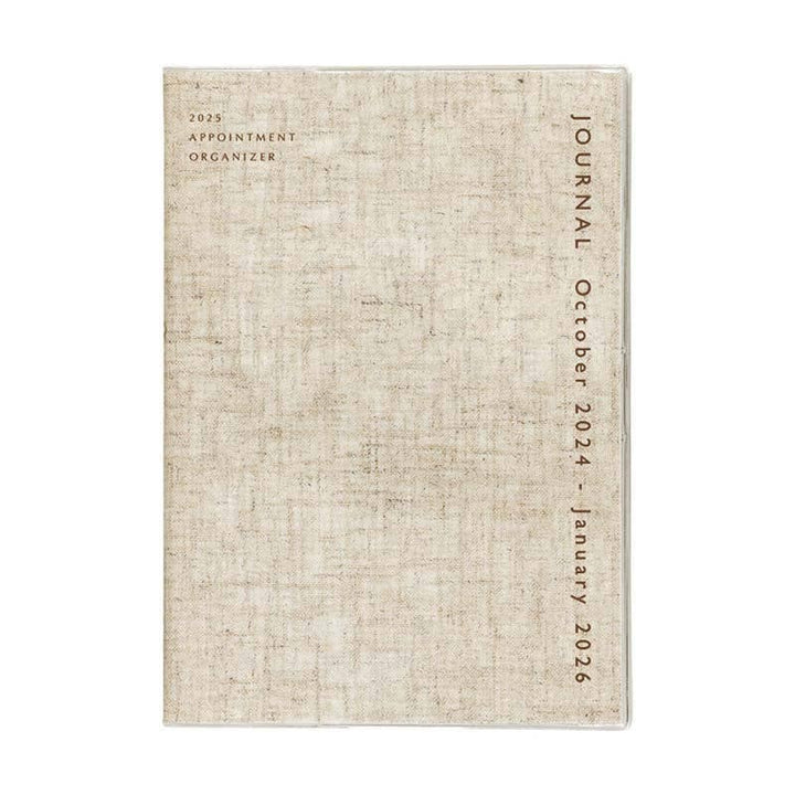 Beige textured journal with tJournal October 2024 - January 2026 on a white background