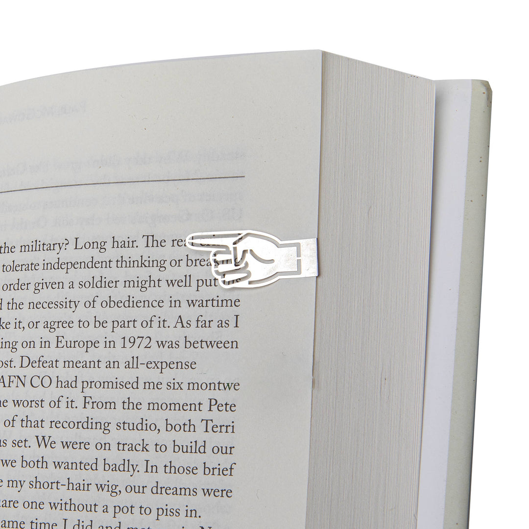 Metal bookmark shaped like a hand on an open book