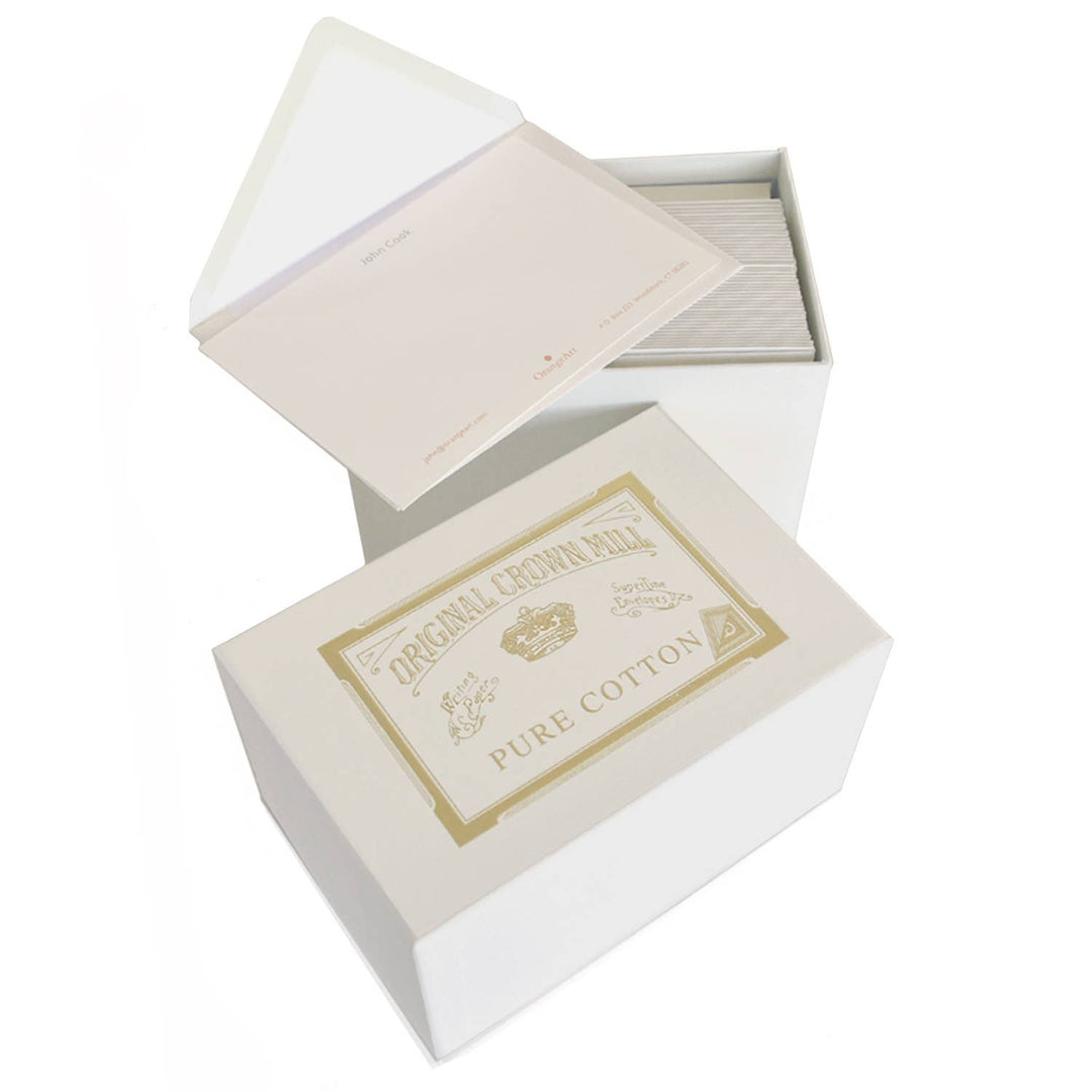 Open box of pure cotton with a visible brand label on a white background