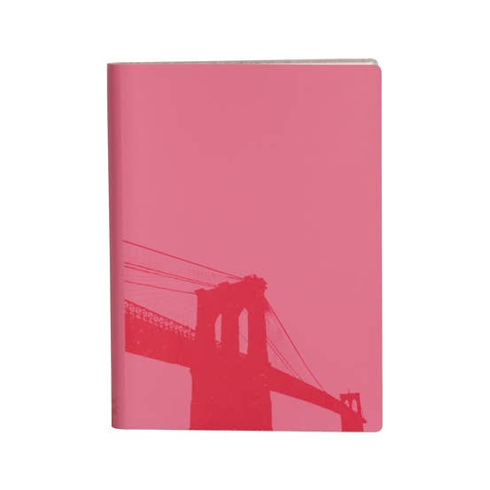 Pink notebook with a bridge silhouette on a white background