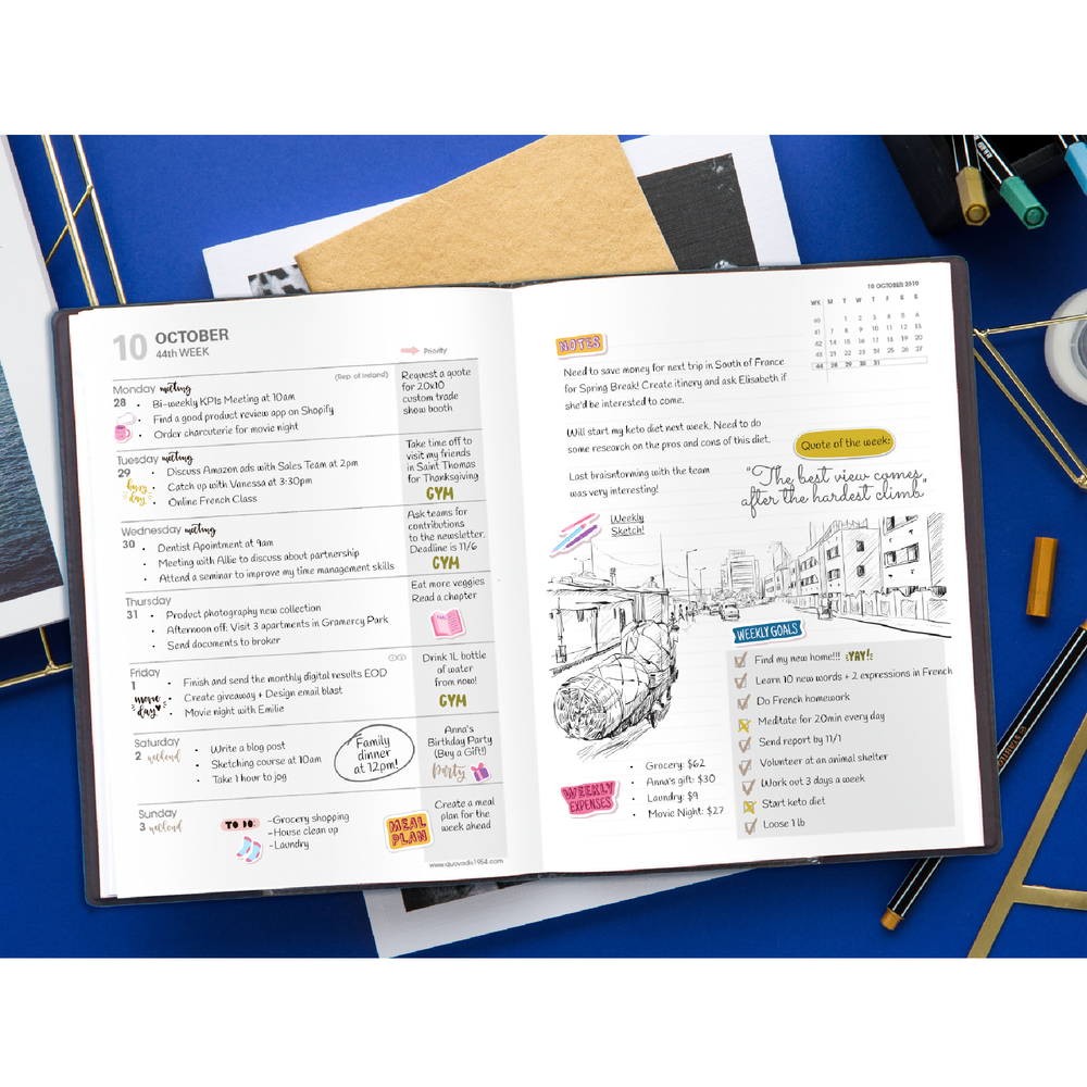 Open planner with daily tasks and notes on a blue surface with stationery items.