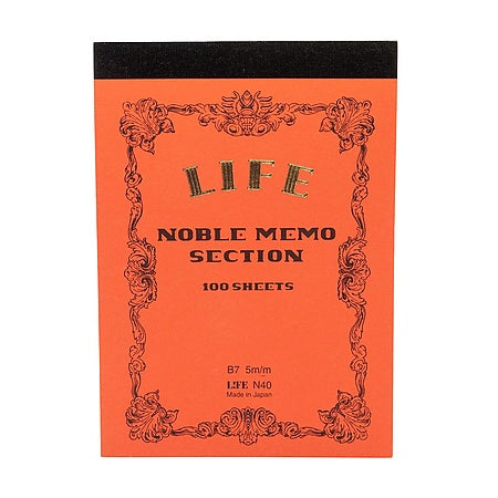 Orange notebook with decorative border and text on a white background.
