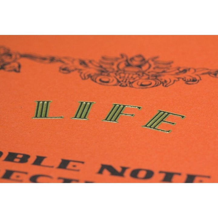 Notebook cover with decorative text and 'LIFE' on an orange background.