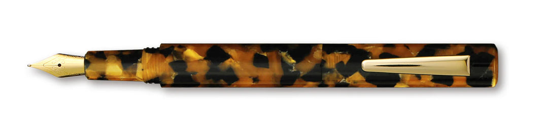 Fountain pen with tortoiseshell and gold accents on a white background