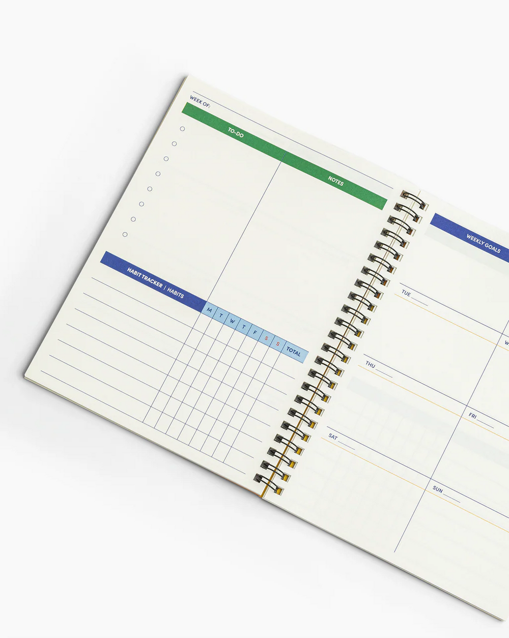 Open spiral-bound planner with weekly layout on a white background