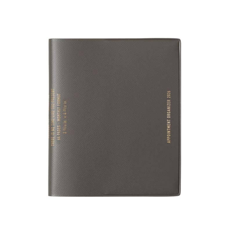 Dark gray planner with gold text on a white background