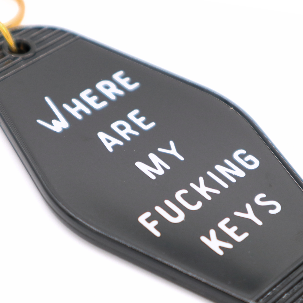 Keychain with text 'WHERE ARE MY FUCKING KEYS' on a white background