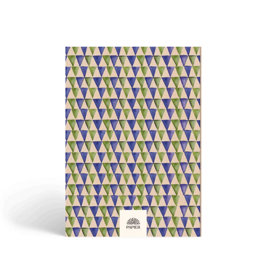 Book with geometric triangle pattern on a white background.