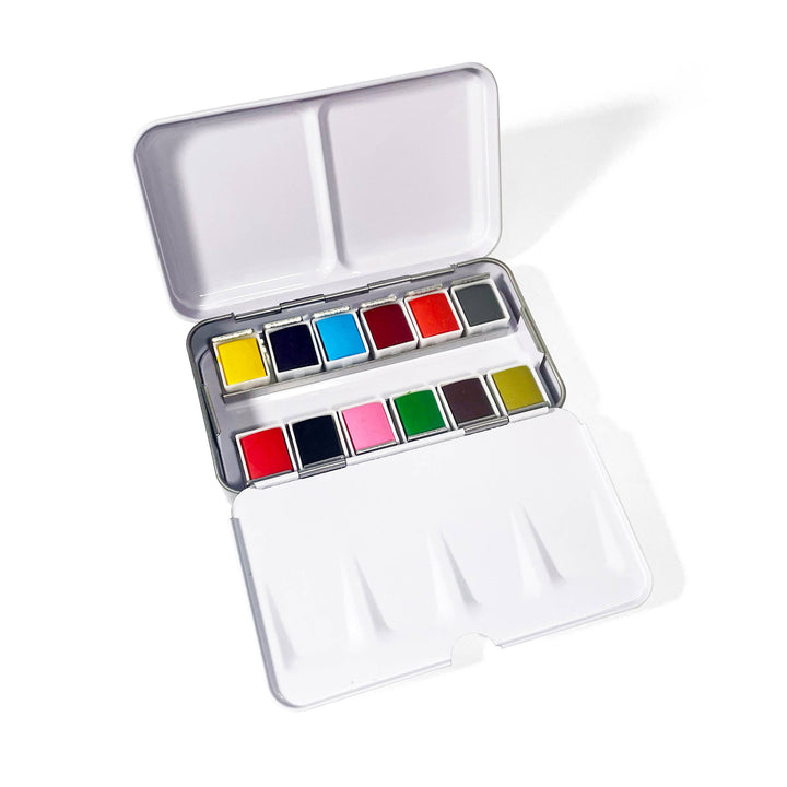 Metallic watercolor paint set with various colors on a white background