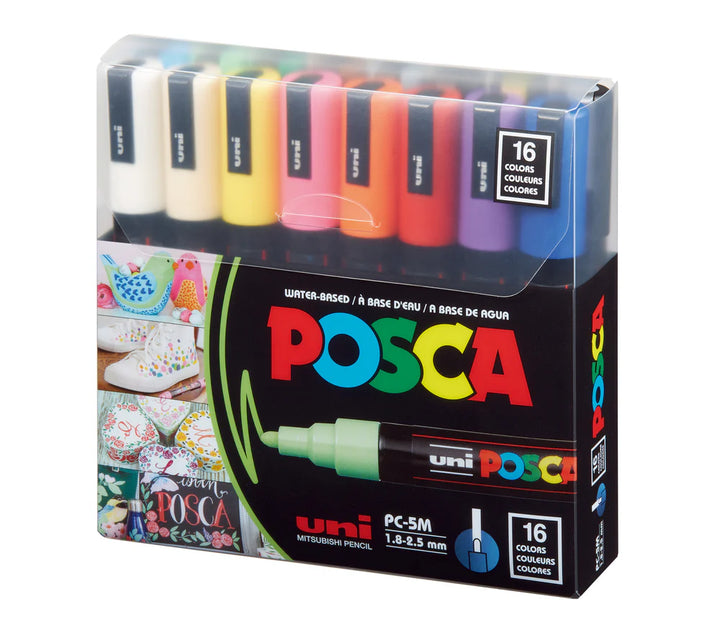 Box of Posca markers with colorful caps on a white background