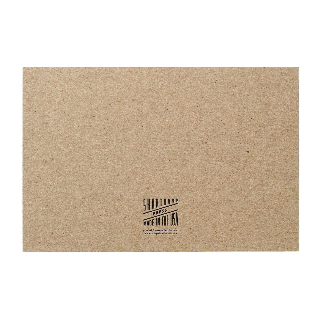 Kraft paper box with 'Shortland Shoes' logo and text on a white background