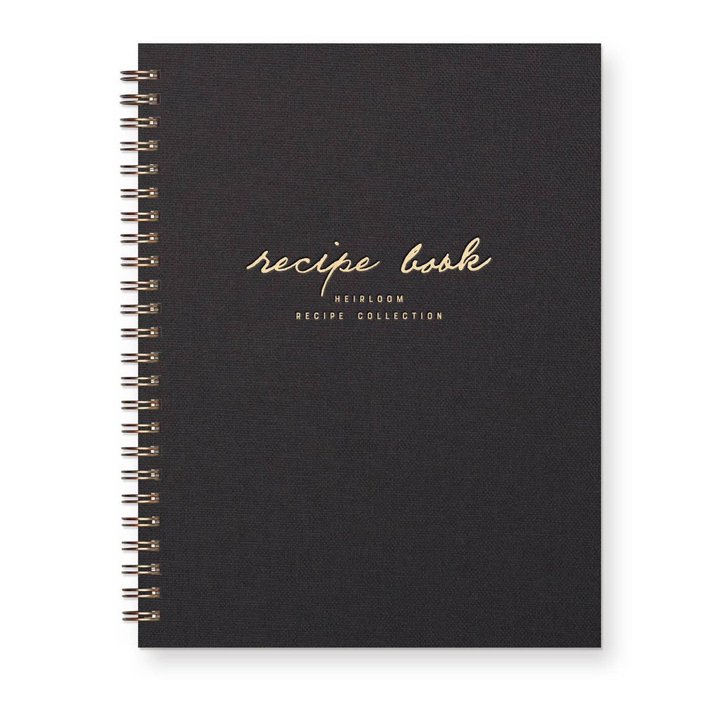 Black recipe book with gold text on a white background