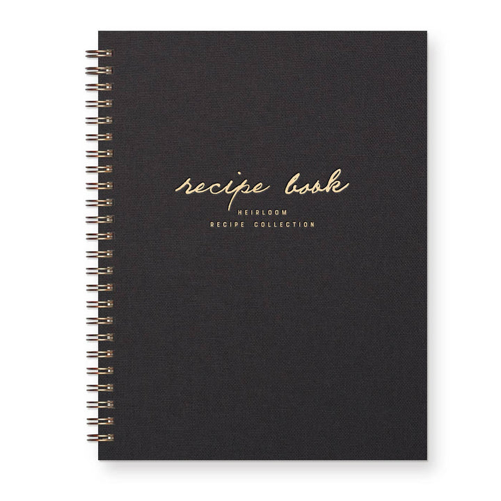 Black recipe book with gold text on a white background