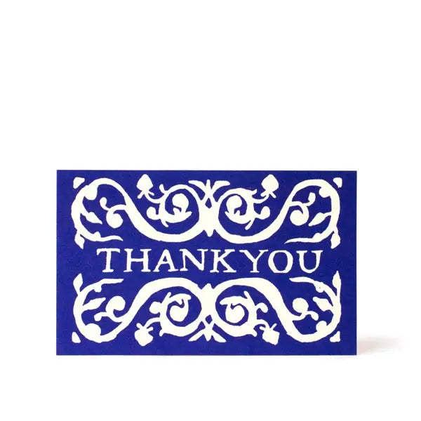 Blue card with white decorative text 'THANK YOU' on a white background
