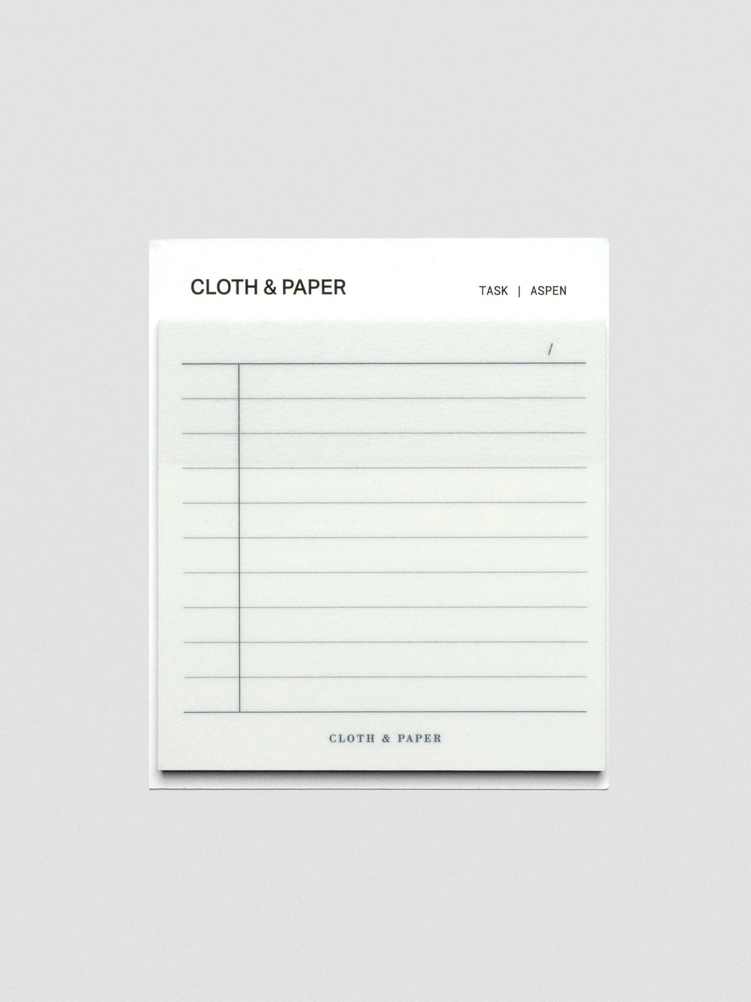 Sticky note with a grid for tasks on a white background