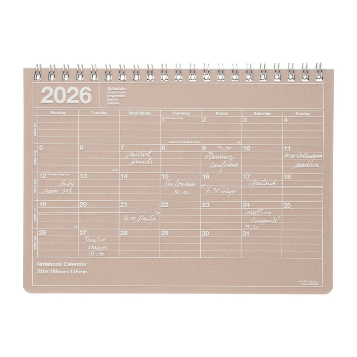 Beige notebook calendar for 2026 on a white background