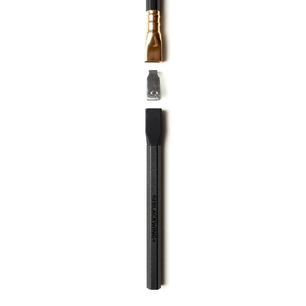 Black pencil with gold ferrule on a white background