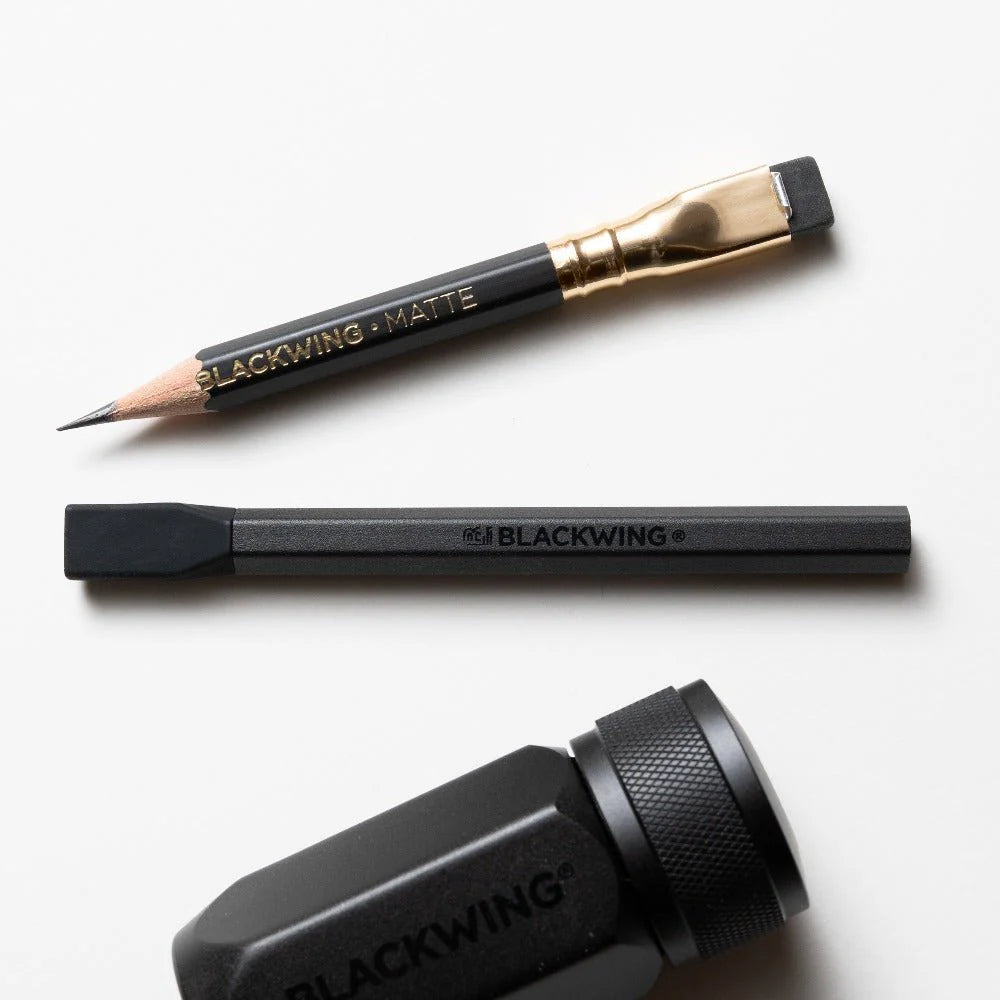 Blackwing pencils and sharpener on a white background
