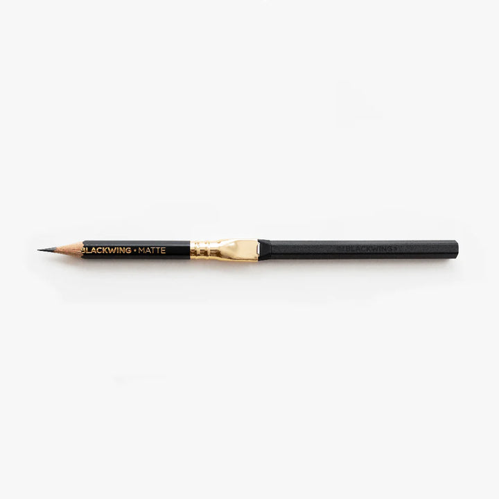Blackwing pencil with an extender on a white background