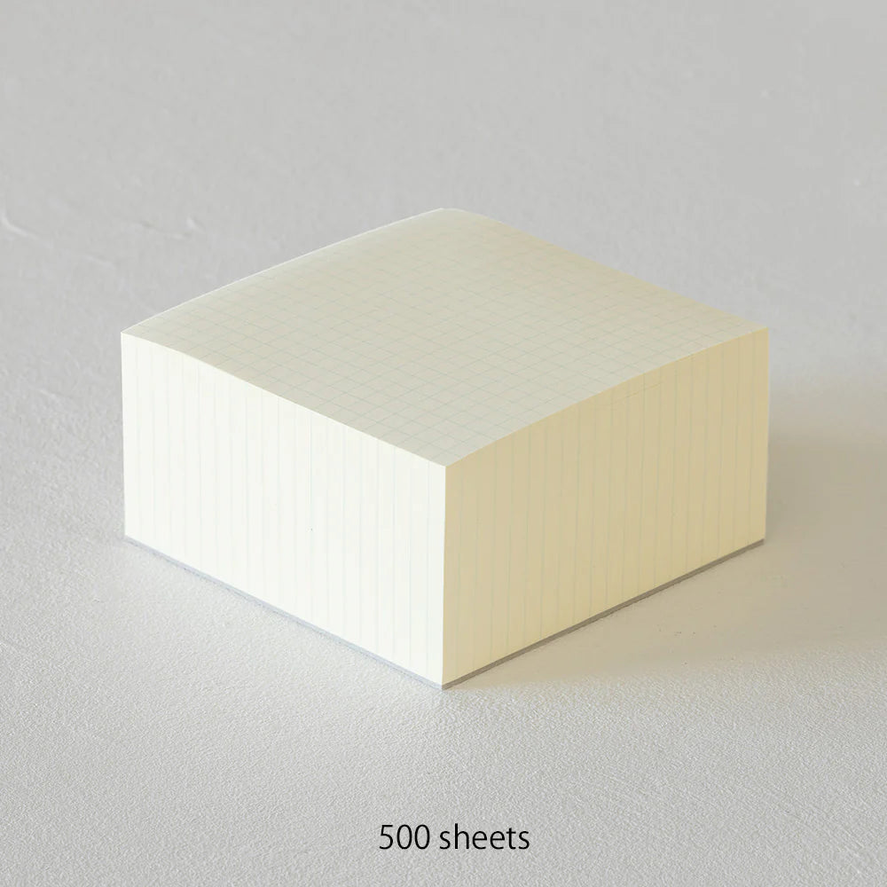 Stack of white paper with a light wood edge on a gray background, labeled '500 sheets'.